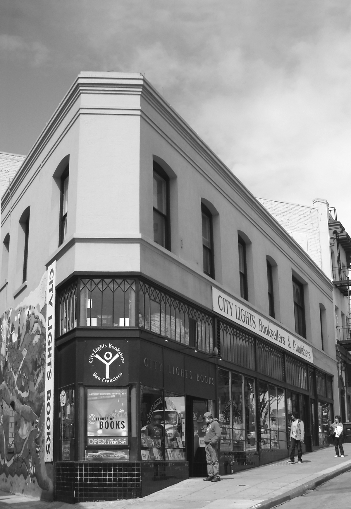 The City Lights triangular storefront, shot head-on, from Kerouac Alley