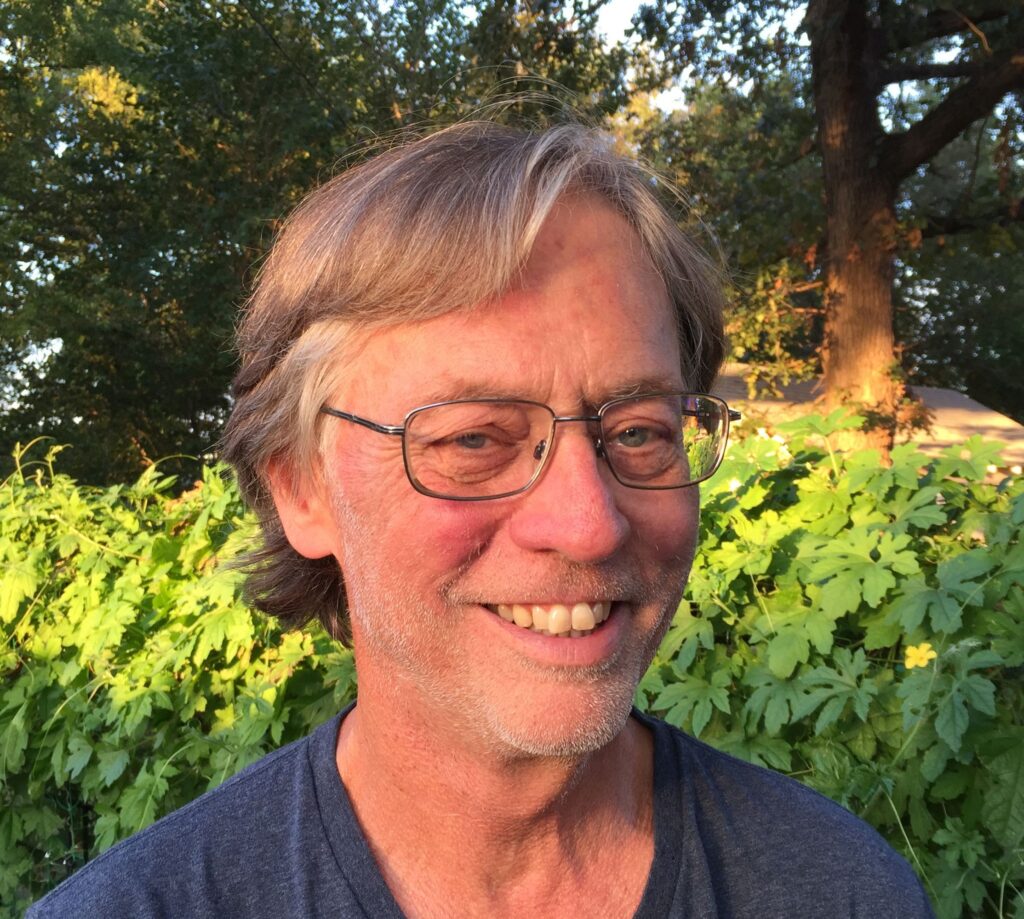 close-up of author stan cox smiling at camera standing outside