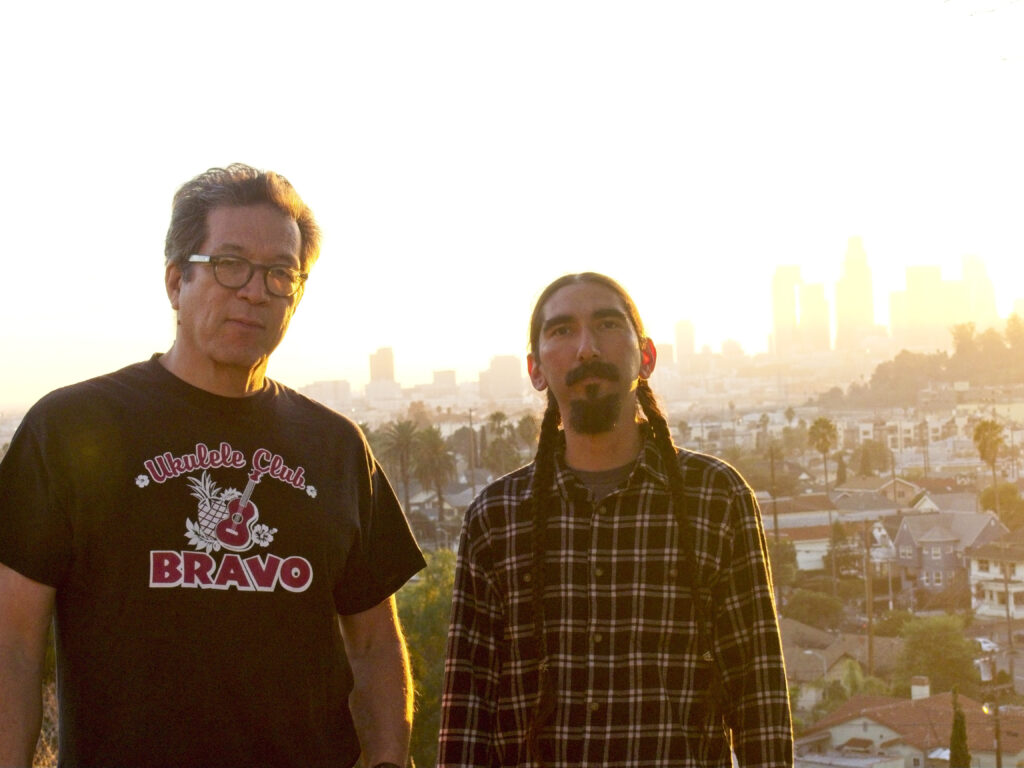 two men stand next to each other