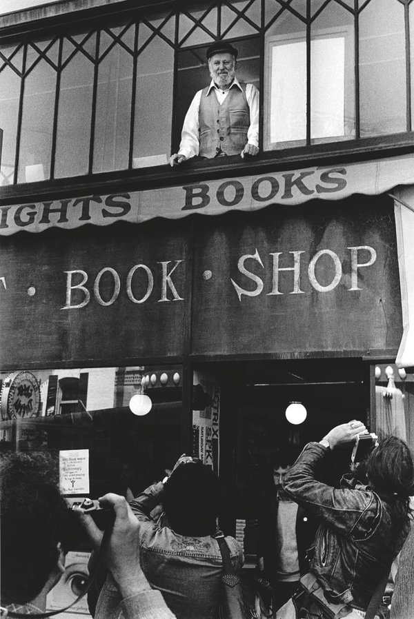 Lawrence Ferlinghetti looking out from City Lights Bookstore window